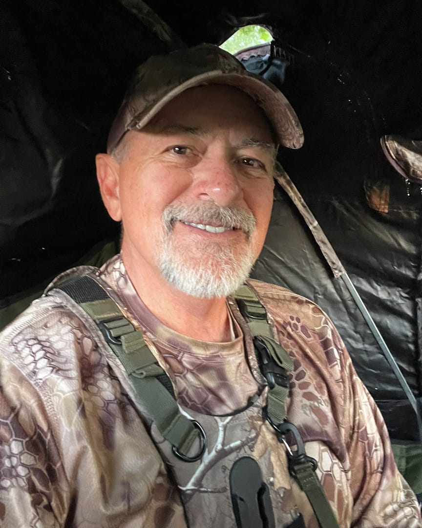 img 7534 iPhotographer sitting inside a chair blind wearing a Kryptek long-sleeve camouflage shirt, ready for an early-morning wildlife session.